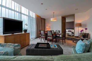 Interior image of the St. Regis Suite at the St. Regis Hotel, showcasing its opulent design with plush furnishings, elegant decor, and a spacious, luxurious layout