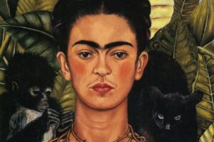 Self-portrait of Frida Kahlo with vibrant colors and bold expression.