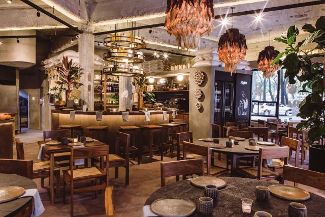 Interior view of Siembra Comedor, adorned with maize-themed decor.