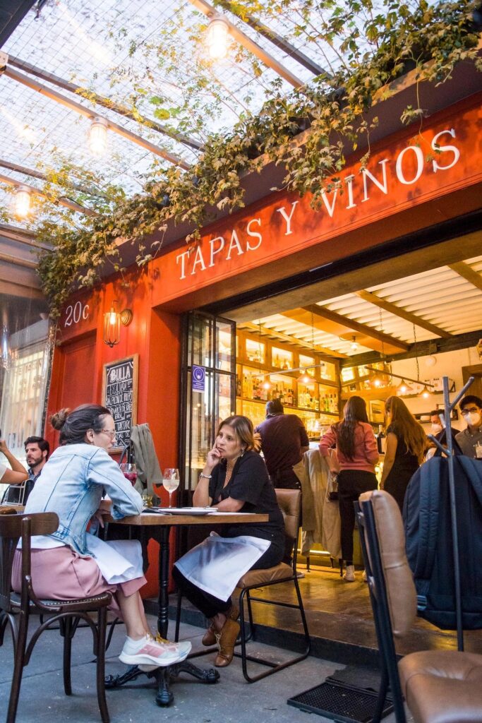 Exterior view of Bulla Condesa with diners enjoying their meals at outdoor tables