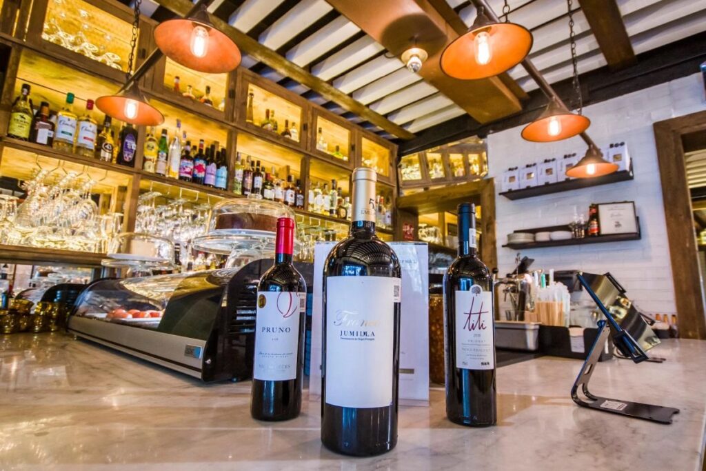 Assortment of fine wines displayed on a table at Bulla Condesa