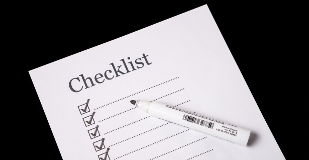 Illustration of a checklist with checkboxes andpen